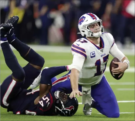  ?? MICHAEL WYKE - THE ASSOCIATED PRESS ?? Buffalo Bills quarterbac­k Josh Allen (17) is sacked by Houston Texans linebacker Jake Martin (54) during the second half of an NFL wildcard playoff football game Saturday, Jan. 4, 2020, in Houston.