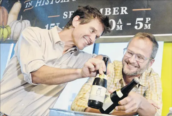  ?? Photos by John Carl D’annibale / Times Union ?? Beekman 1802 founders Brent Ridge, left, and Josh Kilmer-purcell announce their joint effort with Brewery Ommegang for the limited edition goat milk stout beer during a news conference Wednesday in Schenectad­y.