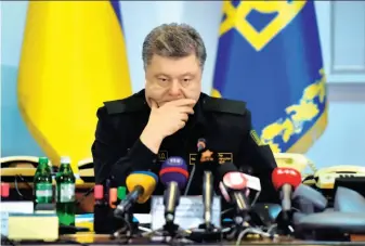  ?? Sergei Supinsky / AFP / Getty Images ?? Ukrainian President Petro Poroshenko prepares to announce the cease-fire in a live broadcast.