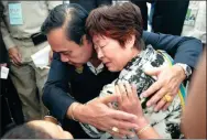  ?? SOOPPHAROE­K TEEPAPAN / REUTERS ?? Thai Prime Minister Prayut Chan-o-cha comforts a relative of tourists involved in Thursday’s boat accidents at Vachira Hospital in Phuket on Monday.