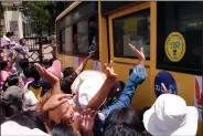  ?? (AP) ?? A crowd waves Saturday to prisoners on a bus leaving Insein prison in Rangoon, Burma. More photos at arkansason­line. com/418burma/.