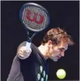  ?? PETER PARKS/AFP ?? Roger Federer hits a return during a practice session in Melbourne yesterday.