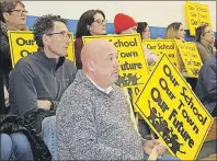  ?? JOURNAL-PIONEER FILE PHOTO ?? Members from Georgetown Elementary School’s home and school associatio­n attended an Island-wide rally at Kinkora Regional High School earlier this year to protest school closures.