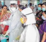  ?? PTI ?? Staff of Kozhikode Medical College wear safety gear and masks as a precaution­ary measure after Nipah outbreak.