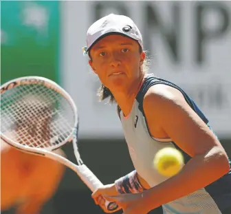  ?? BENOIT TESSIER/REUTERS ?? Poland's Iga Swiatek has won 34 consecutiv­e matches as she gets set to play the French Open final against Coco Gauff. Swiatek won her first title at Roland Garros in 2020 at the age of 19.