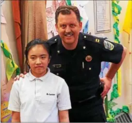  ??  ?? Upper Darby Police Capt. Thomas Johnson and Claire Lin