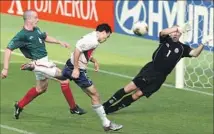  ?? Vincent Yu Associated Press ?? DONOVAN HEADS the ball past Mexico goalkeeper Oscar Perez for a goal in the 2-0 U.S. victory in the 2002 World Cup.