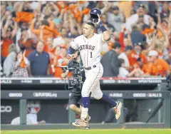  ?? AFP ?? The Astros’ Carlos Correa celebrates after hitting the game-winning home run against the Yankees in Houston.