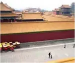  ??  ?? In this photo tourists explore a vast film set replica of Beijing’s Forbidden City at Hengdian World Studios in Dongyang. — AFP photos