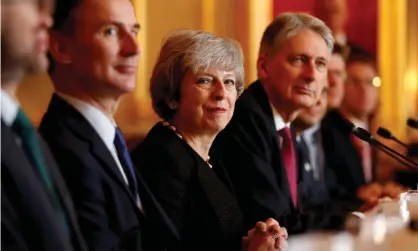  ??  ?? Theresa May with members of her cabinet. Debate on her withdrawal agreement will resume in parliament on 9 January. Photograph: Reuters