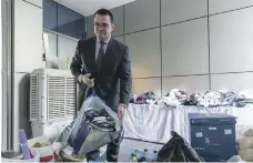  ?? Antonie Robertson / The National ?? Clockwise from right: fire damage extended to the fifth floor and smoke damage went much higher at Zen Tower in Dubai Marina; hotel manager Agusti Curto Calbet looks at goods donated by the public at the Wyndham Hotel; Shelly Douglas, one of the...
