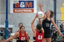  ?? WARWICK SMITH/STUFF ?? Defender Madison Thomas, right, will be a key player for defending champions Manukura Black this year.