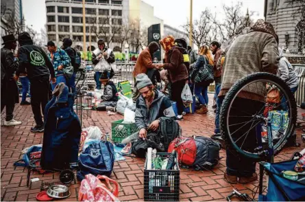  ?? Photos by Gabrielle Lurie/The Chronicle ?? U.N. Plaza remains a hub for sales of drugs and other illegal goods despite San Francisco’s efforts to crack down on such activity.