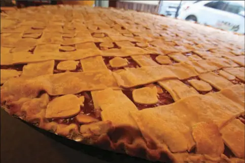  ?? FILE PHOTO ?? The seven-foot apple pie waits to be cut at the 2018 Nappanee Apple Festival.