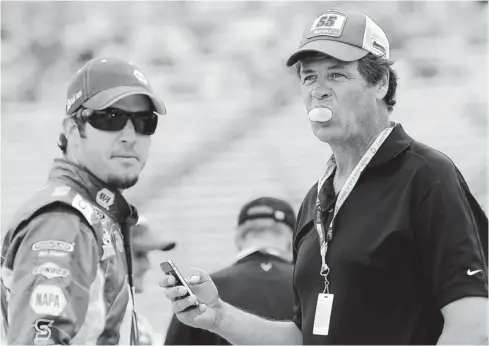  ?? JEROME MIRON, US PRESSWIRE ?? Driver Martin Truex Jr., left, with Michael Waltrip on April 13, 2011, at Texas Motor Speedway, says of his team owner, “It’s been cool to see the smile on his face each week at the racetrack.” Truex and teammate Clint Bowyer are in the Chase for the...