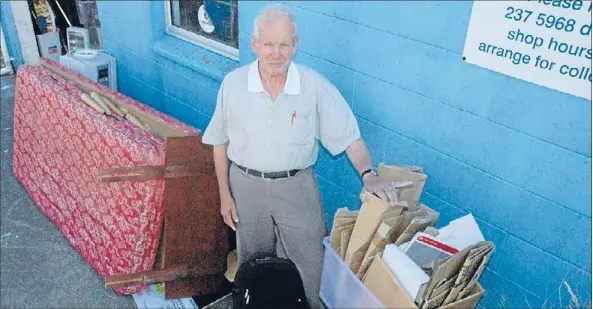  ?? Photo: KRIS DANDO ?? Rubbish collection: St Vincent de Paul’s Joe Ten Broeke with examples of the refuse that is left at the organisati­on’s back entrance regularly.