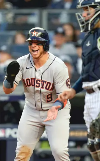  ?? SETH WENIG/AP ?? Astros catcher Christian Vazquez whoops it up at the plate while Chas McCormick rounds the bases after hitting a two-run home run against the Yankees in the second inning Saturday.