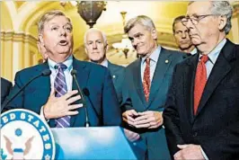  ?? ALEX BRANDON/AP ?? Sen. Lindsey Graham, R-S.C., speaks to the media Tuesday about the Cassidy-Graham bill designed to replace the Affordable Care Act, as Senate leaders and colleagues look on.