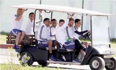  ?? — AP ?? Argentina’s Angel di Maria drives team mates to a training session on Friday, eve of their match against Iceland.