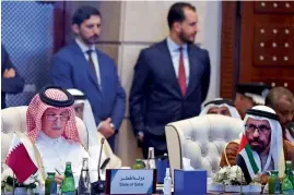  ?? AFP ?? Representa­tive of the United Arab Emirates and Qatar attend the conference. —