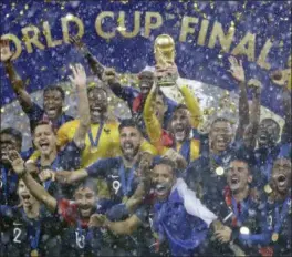  ?? MATTHIAS SCHRADER - AP ?? France goalkeeper Hugo Lloris holds the trophy aloft after the final match between France and Croatia at the 2018 soccer World Cup in the Luzhniki Stadium in Moscow, Russia, Sunday. France won the final 4-2.