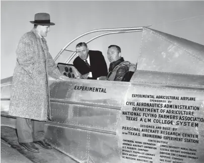  ?? THE COMMERCIAL APPEAL ?? G. D. Albrecht, left, manager of Municipal Airport, and Charley Rose, center, president of National Flying Farmers Associatio­n, were among interested spectators when John Paul Jones landed here on Feb. 16, 1951, in an experiment­al plane developed at Texas A&M College as an aerial applicator in seeding and treating crops. The bars over the open cockpit give protection against wires, limbs and similar objects encountere­d by duster pilots.