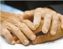  ?? Joint Press Corps ?? Separated relatives from the two Koreas hold each other’s hands during a reunion event on Aug. 25, 2018 at a resort on Mount Geumgang in North Korea.