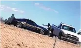  ?? COURTESY OF AUSTIN CONTRERAS VIA KVIA ?? The suspect in the fatal shooting of a State Police officer points a gun at police before being shot and killed in Las Cruces on Thursday.