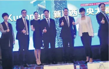  ?? ALBEE ZHANG/AFP/GETTY IMAGES ?? Nicole Meyer, third from left, sister of U.S. White House senior adviser Jared Kushner, was in Shanghai Sunday, seeking investment in a luxury apartment complex project in New Jersey. Meyer urged Chinese investors to buy real estate through a...