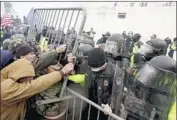  ?? Kent Nishimura Los Angeles Times ?? POLICE TRY to hold back pro-Trump rioters during the deadly Jan. 6 siege at the U.S. Capitol.