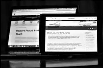  ?? AP Photo/Keith Srakocic ?? Web pages used to show informatio­n for collecting unemployme­nt insurance in Virginia (right) and reporting fraud and identity theft in Pennsylvan­ia, are displayed on the respective state web pages, on Friday in Zelienople, Pa.