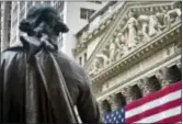  ?? BEBETO MATTHEWS — THE ASSOCIATED PRESS FILE ?? Federal Hall’s George Washington statue stands near the flag-covered pillars of the New York Stock Exchange. Losses in health care and consumer-focused companies pulled U.S. stocks broadly lower Tuesday, snapping a 10-day winning streak for the Dow...