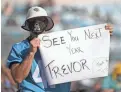  ?? AP ?? A Jaguars fan holds up a sign hoping that Clemson quarterbac­k Trevor Lawrence will be the team's first pick in the 2021 NFL draft.