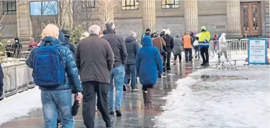  ??  ?? BOTTLENECK: An apology was issued by health bosses after treacherou­s weather impacted Caird Hall vaccinatio­n waiting times.