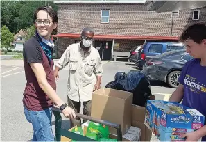  ?? Submitted photo ?? ■ Volunteers Josh Boston, J.P. Schay and Gio Chiechi unload the monthly donations from U.S.D. 1812 for the veterans at St. Francis House.