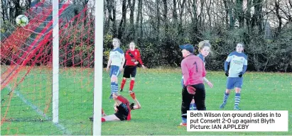  ??  ?? Beth Wilson (on ground) slides in to put Consett 2-0 up against Blyth Picture: IAN APPLEBY