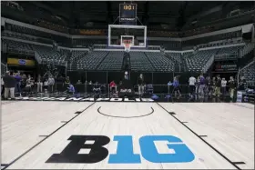  ?? THE ASSOCIATED PRESS ?? The seating area at Bankers Life Fieldhouse is empty as media and staff mill about, Thursday, March 12, 2020, in Indianapol­is.