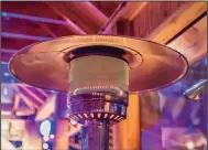  ?? (Dreamstime via TNS) ?? A patio heater can help keep outdoor gatherings going.