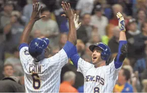  ?? BENNY SIEU / USA TODAY SPORTS ?? Ryan Braun celebrates with Lorenzo Cain after hitting a two-run homer in the first inning.