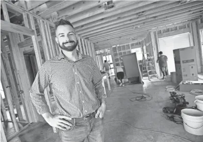  ?? GERALD HERBERT/AP ?? Zach Tyson, owner of Tyson Constructi­on in Destrahan, La., estimates that between 30 and 40 percent of his revenue is coming from baby boomer renovation­s, up from 15 to 20 percent five years ago.