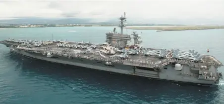  ?? Petty Officer 3rd Class Jessica Blackwell / U.S. Navy 2018 ?? About 1,000 sailors aboard the Navy’s nuclear aircraft carrier Theodore Roosevelt are quarantini­ng in Guam, where the ship is docked. Of the nearly 1,300 crew members who have been screened for the novel coronaviru­s, 93 have tested positive.