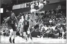  ?? AP/PATRICK SEMANSKY ?? Washington Mystics guard Kristi Toliver (center) shoots in the second half of Game 1 on Sunday of the WNBA Finals against the Connecticu­t Sun in Washington.