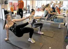  ??  ?? Shannon Krohe left, and Kim Bozick, both of Lawrencevi­lle, work out at 3 Minute Fitness on the South Side.