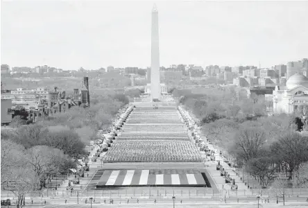  ?? SUSAN WALSH/GETTY-AFP ?? The National Mall in Washington is decorated with US flags Tuesday before the inaugurati­on of President-elect Joe Biden.