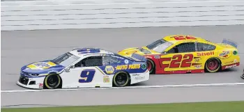  ?? ORLIN WAGNER/ASSOCIATED PRESS ?? Chase Elliott (9) leads Joey Logano (22) on the first lap of a NASCAR Cup Series race at Kansas Speedway last Sunday. Elliott will start today’s race in Texas just below the cutoff line for the top four.
