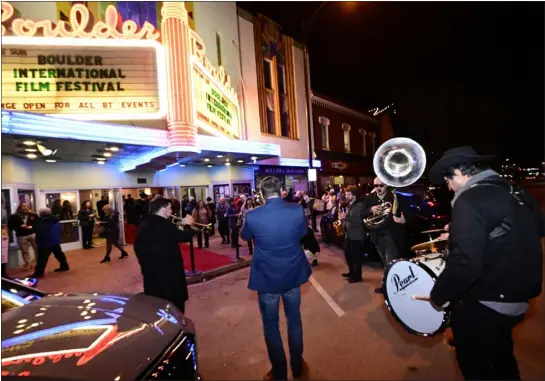  ?? CLIFF GRASSMICK — STAFF PHOTOGRAPH­ER ?? The brass band Guerrilla Fanfare led people to the Boulder Theater on Friday evening, the opening night of the 19th annual Boulder Internatio­nal Film Festival.