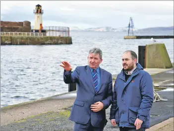  ??  ?? Council leader Joe Cullainne, right, at Ardrossan Harbour with Peel Ports’ chief operating officer Gary Hodgson.