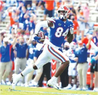  ?? FLORIDA PHOTO BY ALEX DE LA OSA ?? Florida junior tight end Kyle Pitts had five catches for 99 yards and three touchdowns during last Saturday’s 34-10 win over Kentucky.