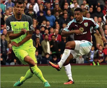  ??  ?? SEALED AND DELIVERED: Andre Gray scores Burnley’s second of the day to kill off Liverpool’s challenge
