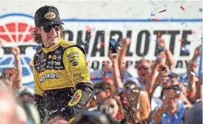  ??  ?? Ryan Blaney celebrates Sunday after winning the Bank of America Roval 400 at Charlotte Motor Speedway. JASEN VINLOVE/USA TODAY